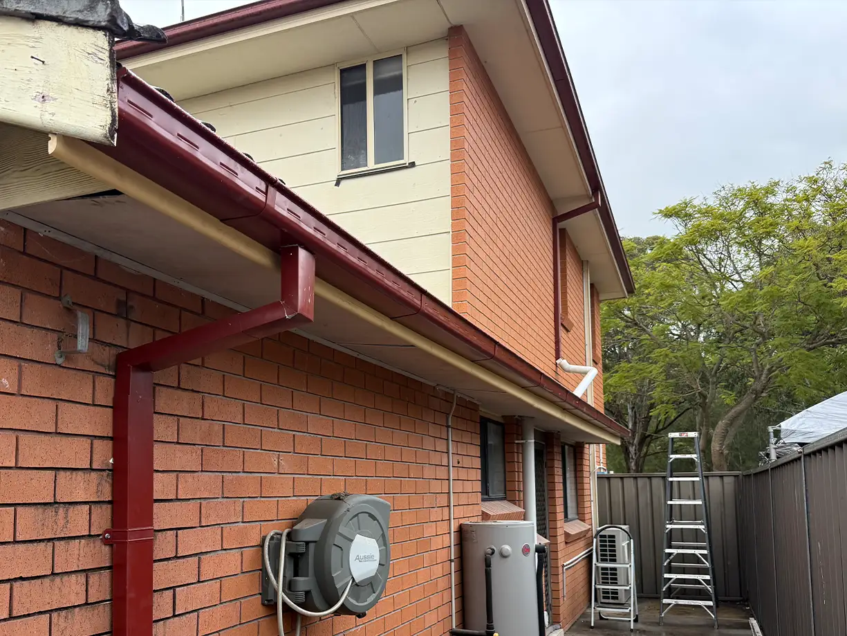 New Manor Red gutter timber fascia soffit and COLORBOND downpipe in Bossley Park
