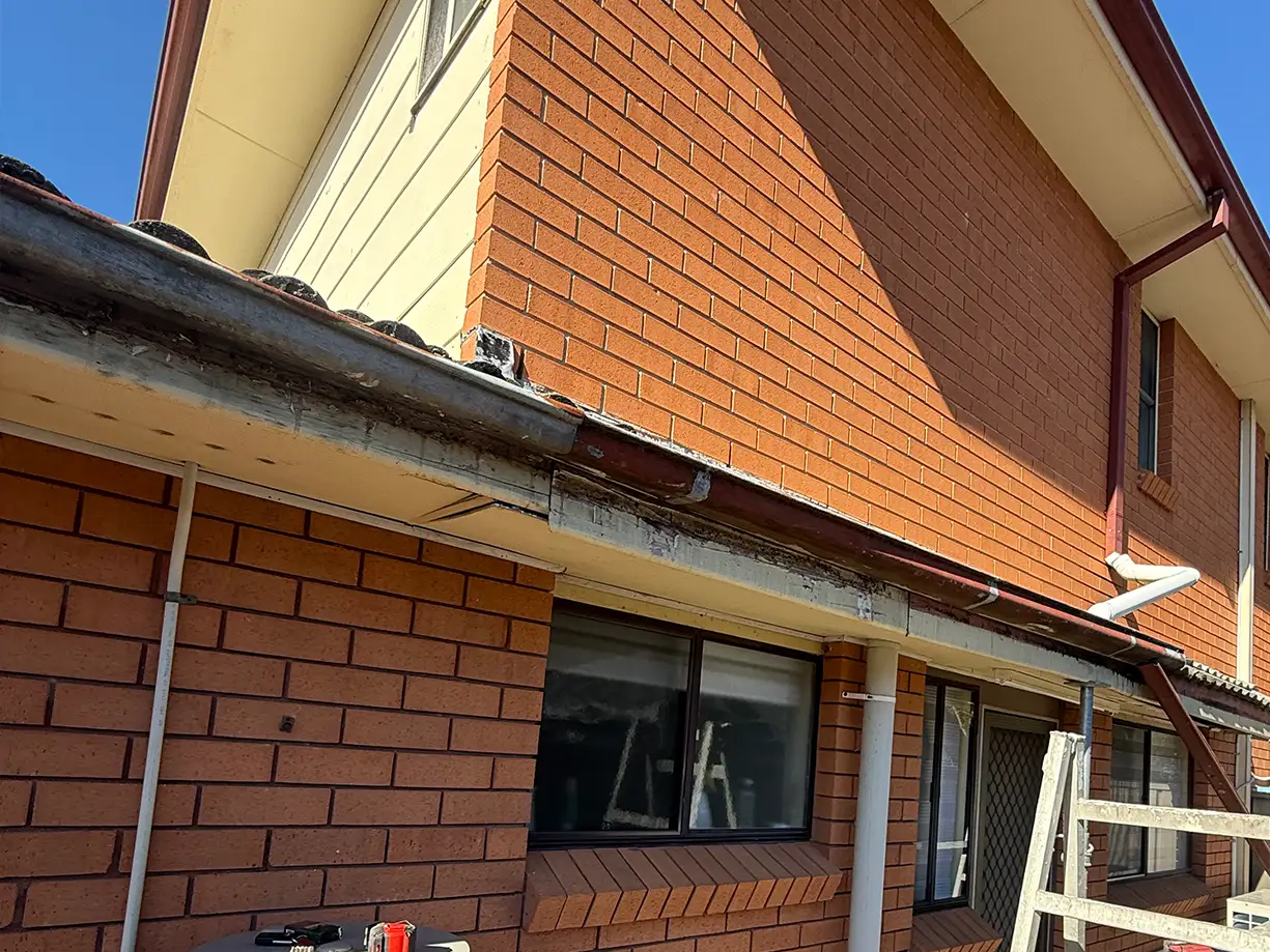 Damaged gutter and fascia before replacement in Bossley Park NSW