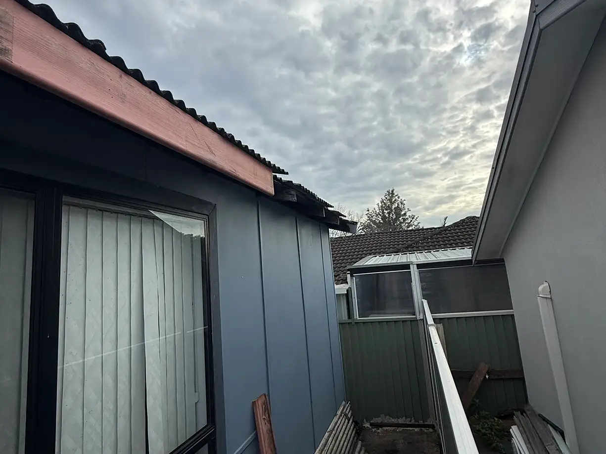 Damaged gutter and fascia before replacement in Guildford NSW